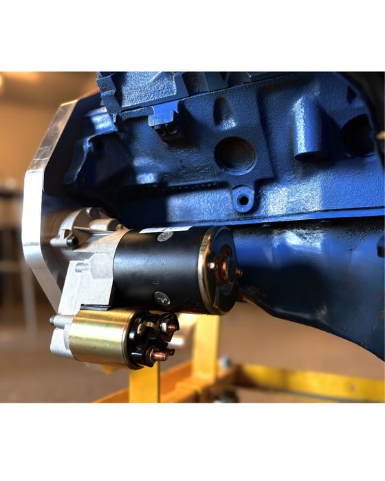 Close-up of a mechanical component with a focus on a black and gold part.